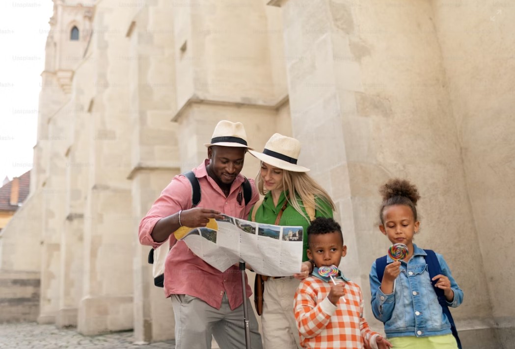 Private tour guide explaining pyramid history to small family group with personalized attention and detailed information